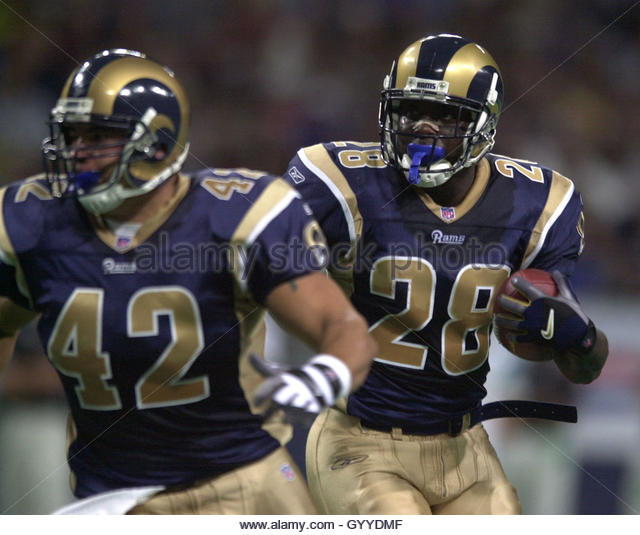 st-louis-rams-runningback-marshall-faulk-28-picks-up-a-block-from-gyydmf.jpg